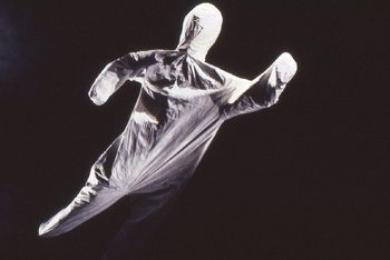 simple figure covered in white cloth moves in mid-air