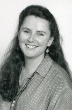 portrait of girl with long dark hair over one shoulder