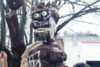 children holding their larger than life-size puppet Koori warrior